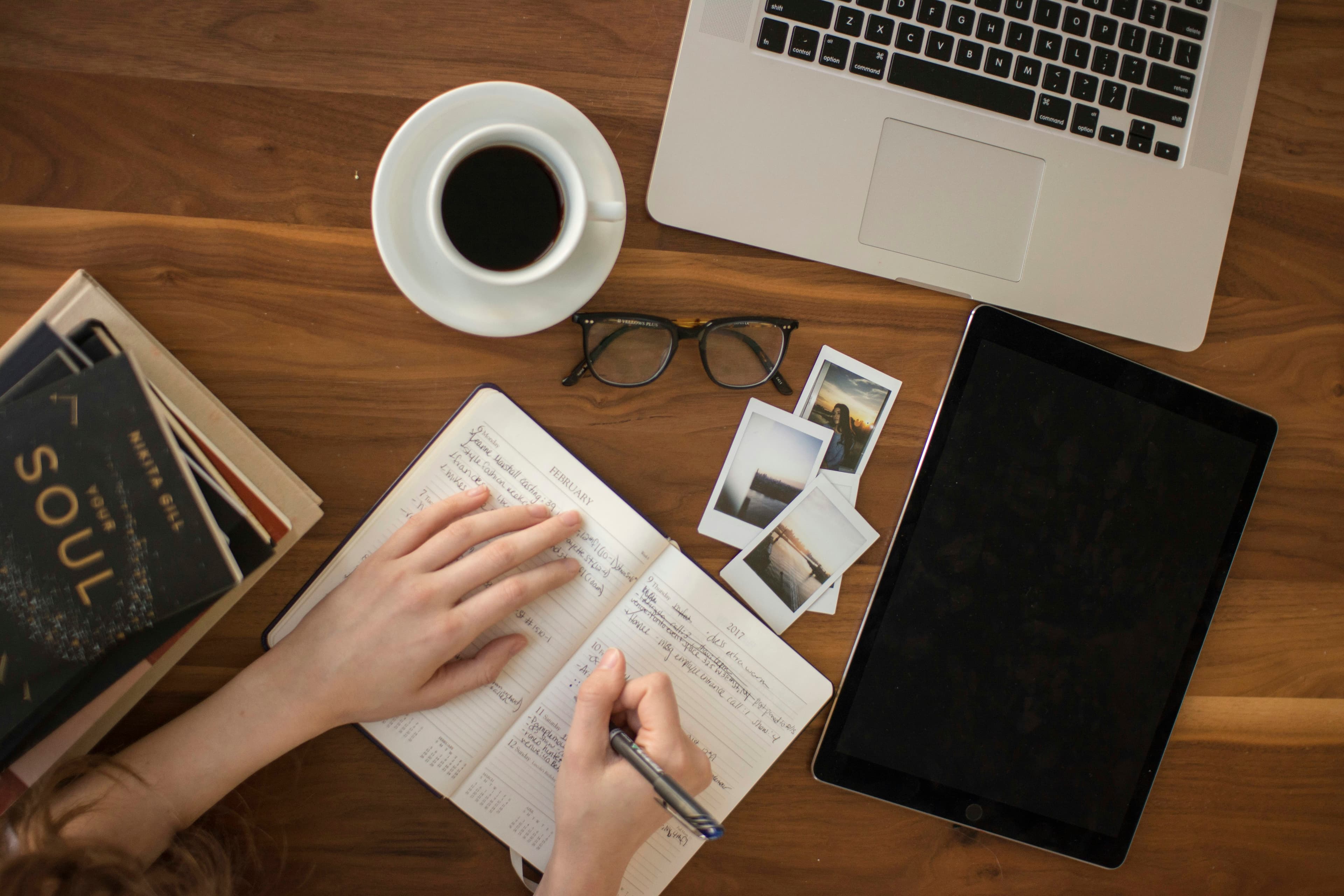 Structured notes and template documents organized on a desk — representing the CLAUDE.md file structure and organization