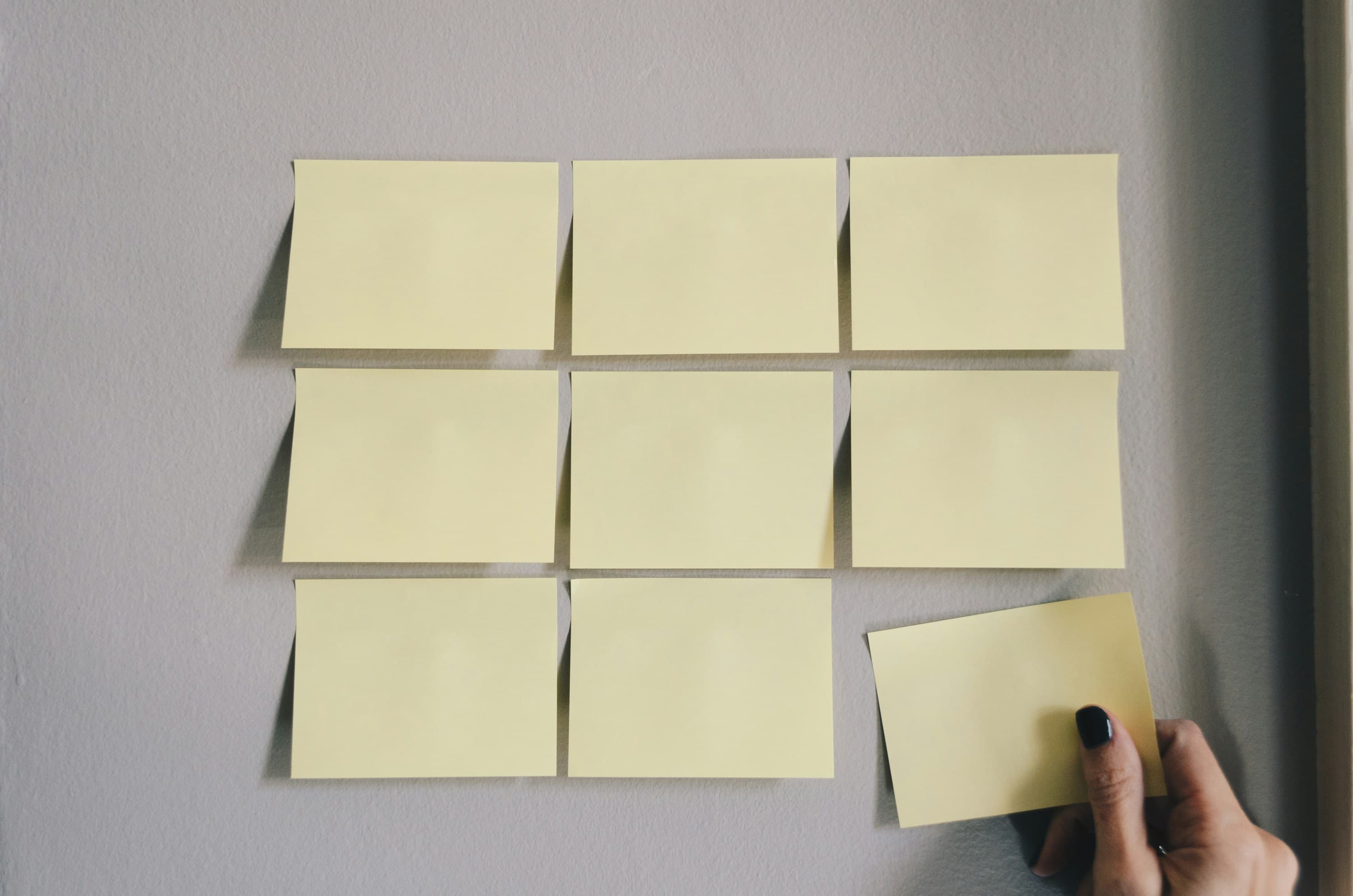 Architecture blueprints and decision documents on a desk, representing Architecture Decision Records